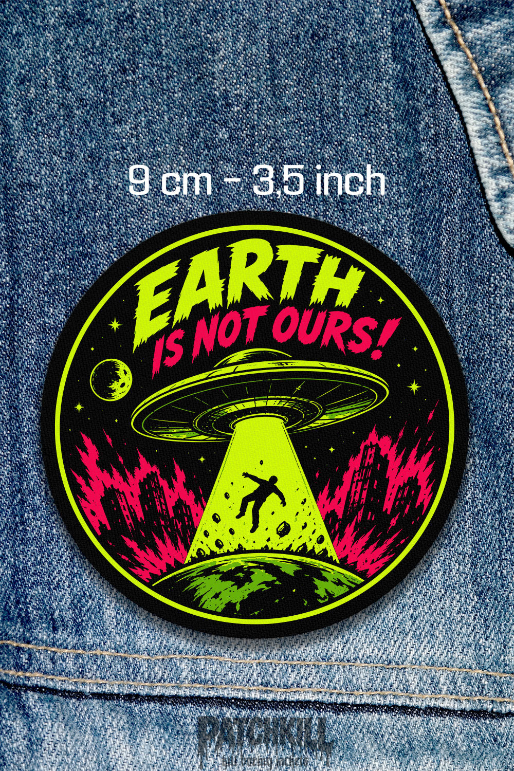 Earth Is Not Ours UFO alien circle patch with neon green and pink flying saucer abduction design on denim jacket
